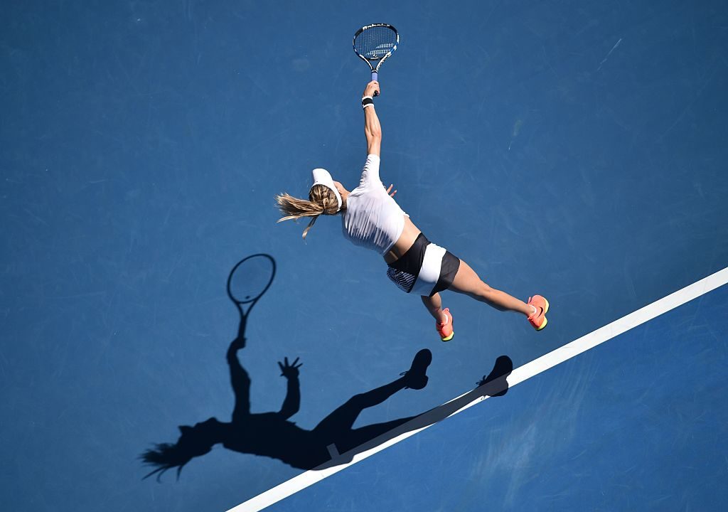Eugenie Bouchard of Canada serves against Peng Shuai of China in their women's singles match on day three of the Australian Open tennis tournament in Melbourne on January 18, 2017. / AFP / PETER PARKS / IMAGE RESTRICTED TO EDITORIAL USE - STRICTLY NO COMMERCIAL USE (Photo credit should read PETER PARKS/AFP/Getty Images)