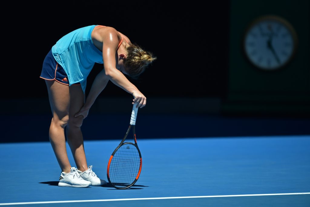 Romania's Simona Halep reacts after a point against Shelby Rogers of the US during their women's singles match on day one of the Australian Open tennis tournament in Melbourne on January 16, 2017. / AFP / PETER PARKS / IMAGE RESTRICTED TO EDITORIAL USE - STRICTLY NO COMMERCIAL USE (Photo credit should read PETER PARKS/AFP/Getty Images)