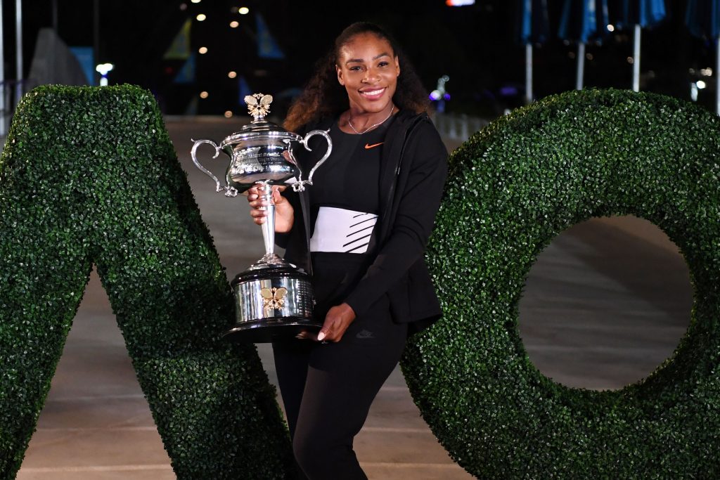 Serena Williams of the US poses with the championship trophy after her victory against Venus Williams of the US in the women's singles final on day 13 of the Australian Open tennis tournament in Melbourne on January 29, 2017. / AFP / SAEED KHAN / IMAGE RESTRICTED TO EDITORIAL USE - STRICTLY NO COMMERCIAL USE (Photo credit should read SAEED KHAN/AFP/Getty Images)