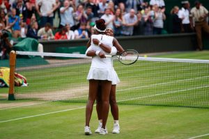 LONDON, ENGLAND - JULY 09: Venus Williams of The United States and Serena Williams of The United States celebrate victory in the Ladies Doubles Final against Timea Babos of Hungary and Yaroslava Shvedova of Kazakhstan on day twelve of the Wimbledon Lawn Tennis Championships at the All England Lawn Tennis and Croquet Club on July 9, 2016 in London, England. (Photo by Adam Pretty/Getty Images)