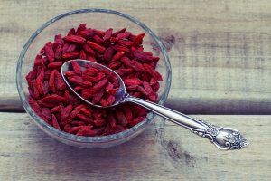 Overhead view of Goji berries on a wood background