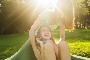 Mom playing with Daughter at the park