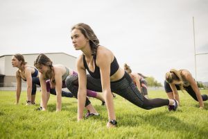 Young women athletes on school playing field