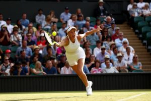 LONDON, ENGLAND - JULY 04: Caroline Wozniacki of Denmark plays a forehand during the Ladies Singles first round match against Timea Babos of Hungary on day two of the Wimbledon Lawn Tennis Championships at the All England Lawn Tennis and Croquet Club on July 4, 2017 in London, England. (Photo by Michael Steele/Getty Images)