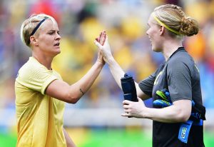 RIO DE JANEIRO, BRAZIL - AUGUST 03: Golal scorer Nilla Fischer of Sweden celebrates with Hedvig Lindahl during the Olympic Womens Football match between Sweden and South Africa during the at Olympic Stadium on August 3, 2016 in Rio de Janeiro, Brazil. (Photo by Stuart Franklin - FIFA/FIFA via Getty Images)