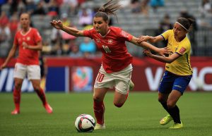 VANCOUVER, BC - JUNE 12: Ramona Bachmann of Switzerland and Angie Ponce of Ecuador challenge for the ball during the FIFA Women's World Cup 2015 Group C match between Switzerland and Ecuador at BC Place Stadium on June 12, 2015 in Vancouver, Canada. (Photo by Matthew Lewis - FIFA/FIFA via Getty Images)