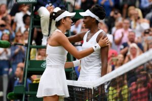 LONDON, ENGLAND - JULY 15: A victorious Garbine Muguruza of Spain is embraced by Venus Williams of The United States after the Ladies Singles final on day twelve of the Wimbledon Lawn Tennis Championships at the All England Lawn Tennis and Croquet Club at Wimbledon on July 15, 2017 in London, England. (Photo by Shaun Botterill/Getty Images)